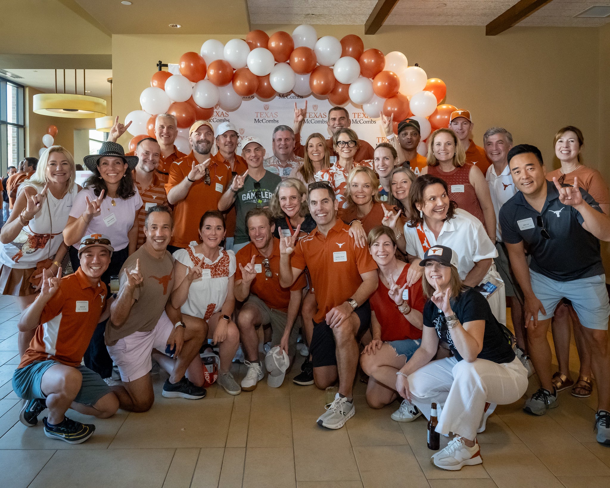 Group of alumni with balloon arch